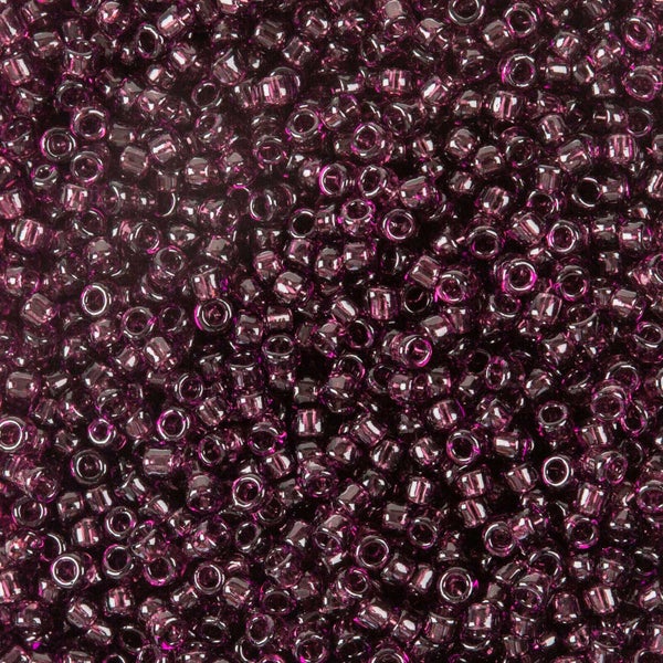 Toho siemenhelmi 15/0 l&auml;pin&auml;kyv&auml; tumma violetti [transparent amethyst], 8,3 g
